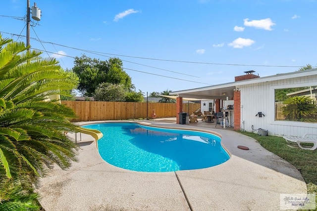 view of swimming pool with a fenced backyard, a fenced in pool, a water slide, and a patio