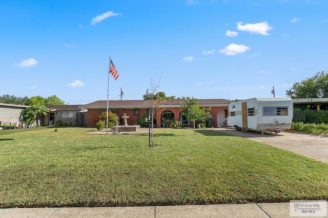 ranch-style house featuring a front lawn