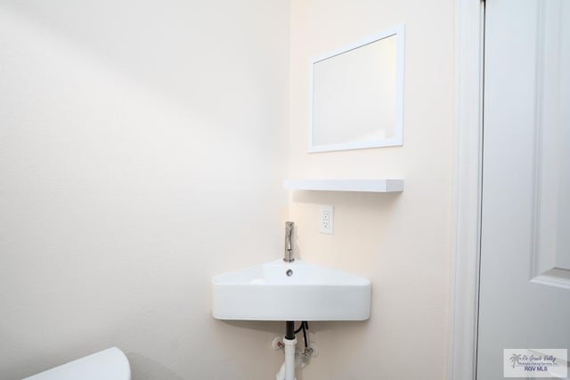 bathroom with toilet and sink