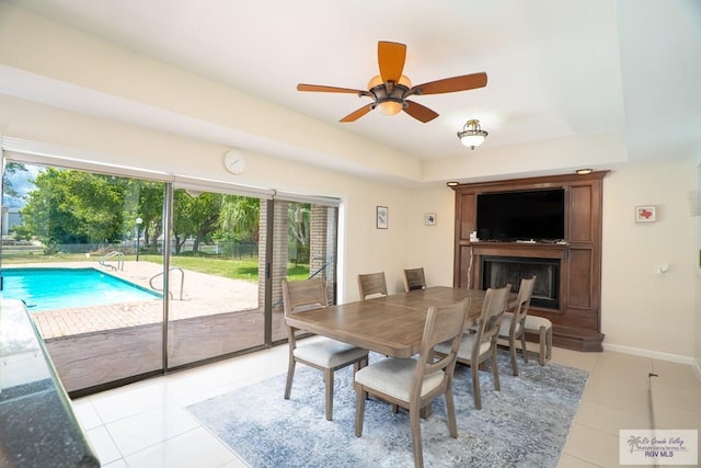 dining area featuring ceiling fan and light tile patterned floors