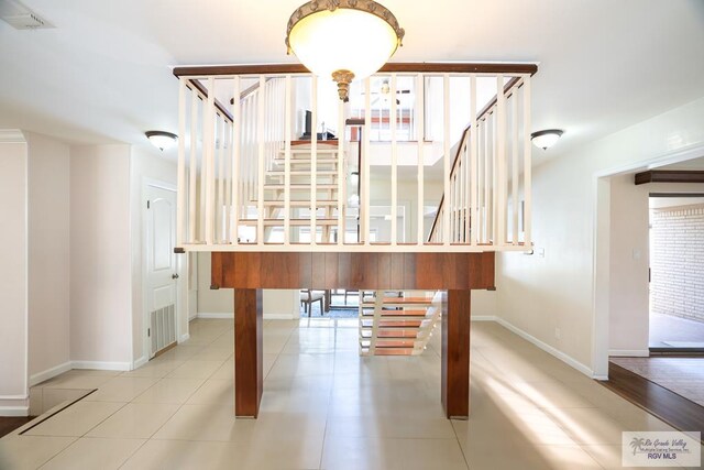 miscellaneous room featuring light tile patterned floors