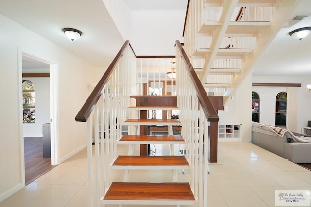 staircase with tile patterned flooring