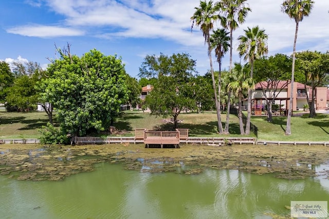 exterior space with a yard and a water view