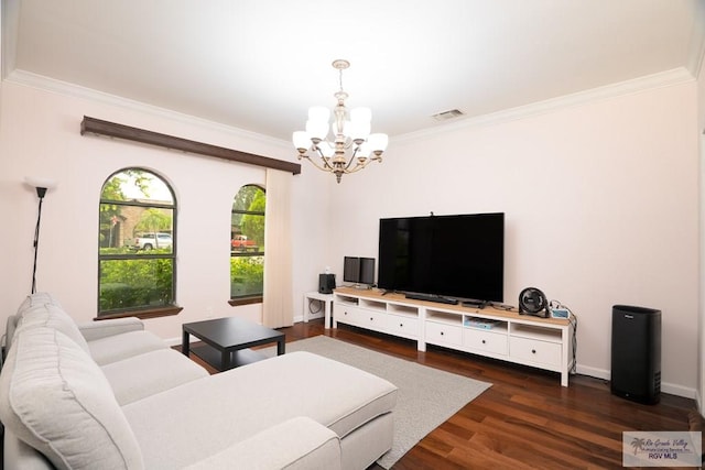 living room featuring a notable chandelier, dark hardwood / wood-style flooring, and crown molding