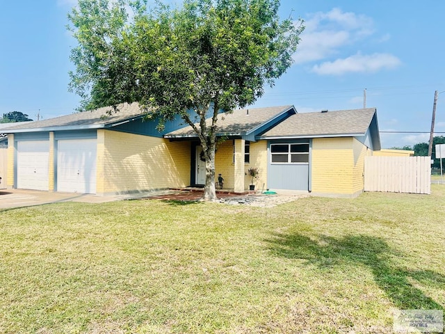 3104 Buckingham Ct, Brownsville, TX 78526 - view of front facade with brick siding, an attached garage, and roof with shingles