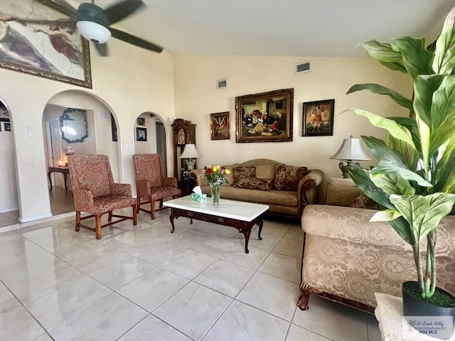 3104 Buckingham Ct, Brownsville, TX 78526 - living room with arched walkways, a ceiling fan, vaulted ceiling, and light tile patterned floors