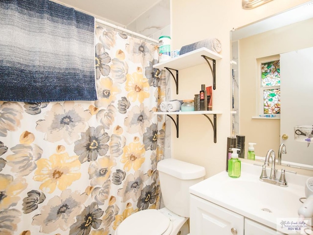 3104 Buckingham Ct, Brownsville, TX 78526 - bathroom with vanity, toilet, and a shower with shower curtain