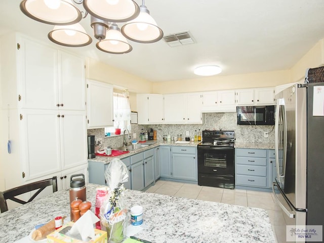 3104 Buckingham Ct, Brownsville, TX 78526 - kitchen with black appliances, a sink, white cabinetry, and tasteful backsplash