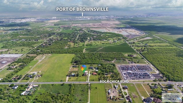 birds eye view of property with a rural view