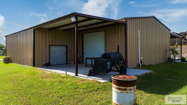 view of outdoor structure with a lawn