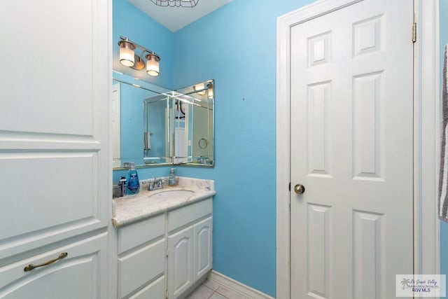 bathroom with tile patterned flooring and vanity