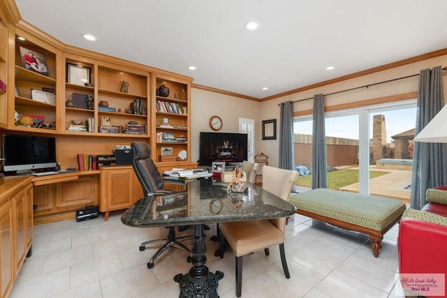 tiled office space with built in desk and ornamental molding