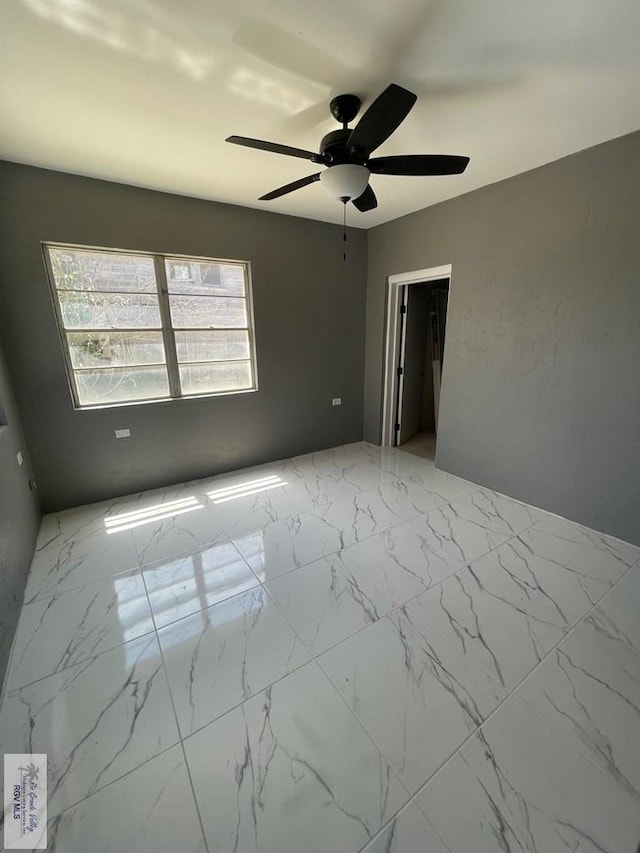 empty room featuring ceiling fan