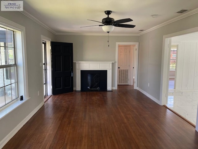 unfurnished living room featuring ceiling fan, dark hardwood / wood-style flooring, and ornamental molding