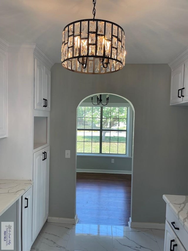 dining space featuring light hardwood / wood-style floors and a notable chandelier