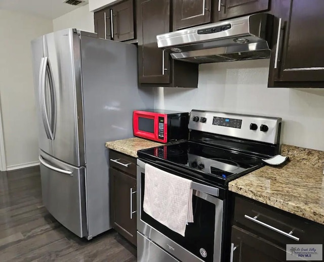 kitchen featuring dark wood-type flooring, appliances with stainless steel finishes, under cabinet range hood, and dark brown cabinets
