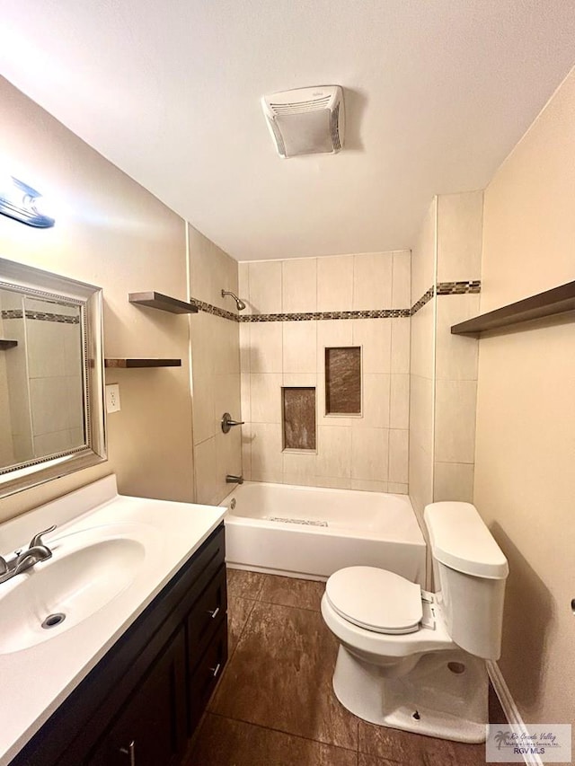 bathroom featuring toilet, bathtub / shower combination, and vanity