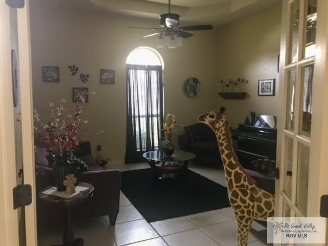 interior space featuring ceiling fan and light tile patterned flooring