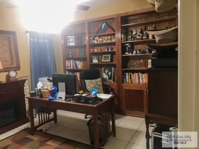 home office featuring light tile patterned floors