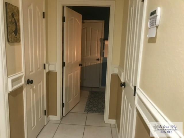 hallway with light tile patterned flooring