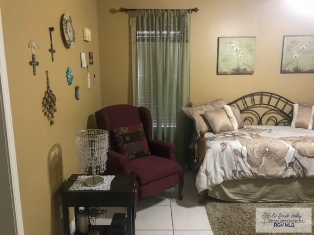 bedroom featuring light tile patterned floors