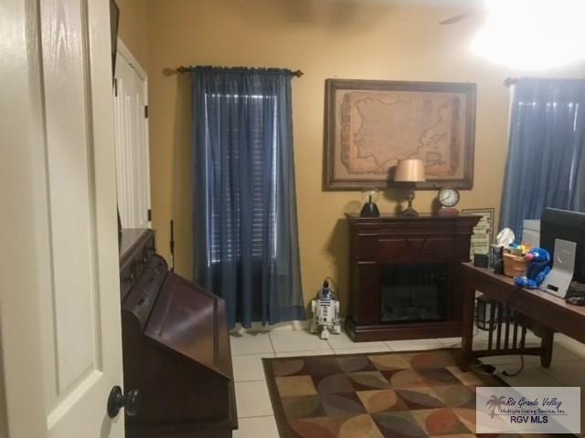 living area featuring tile patterned floors