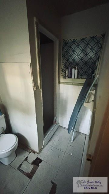 bathroom featuring tile patterned floors and toilet