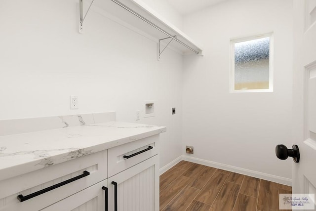 laundry area with hookup for an electric dryer, cabinets, and hookup for a washing machine