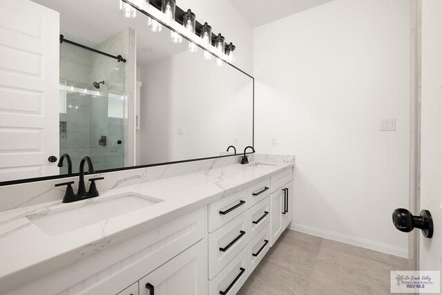 bathroom featuring vanity and a shower with shower door