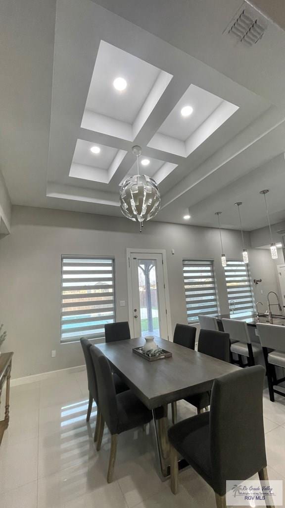 dining space with light tile patterned floors, baseboards, visible vents, coffered ceiling, and recessed lighting