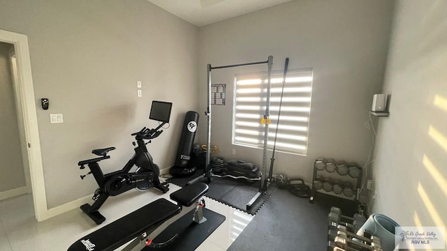 exercise room with baseboards