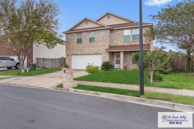1013 Champlain Dr, Brownsville, TX 78526 - view of front of house featuring concrete driveway and an attached garage
