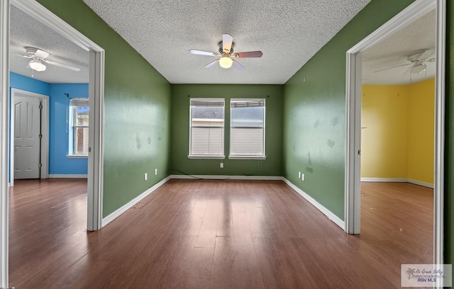 1013 Champlain Dr, Brownsville, TX 78526 - spare room with a ceiling fan, a textured ceiling, and wood finished floors