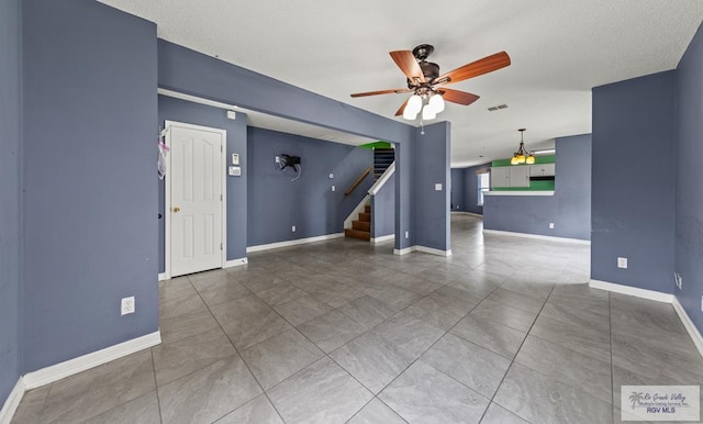 1013 Champlain Dr, Brownsville, TX 78526 - spare room with ceiling fan and stairway
