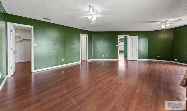 1013 Champlain Dr, Brownsville, TX 78526 - spare room with ceiling fan, a textured ceiling, and wood finished floors