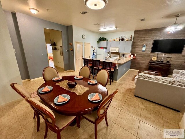 dining space featuring light tile patterned floors