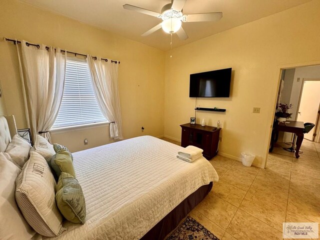 bedroom featuring ceiling fan and light tile patterned flooring