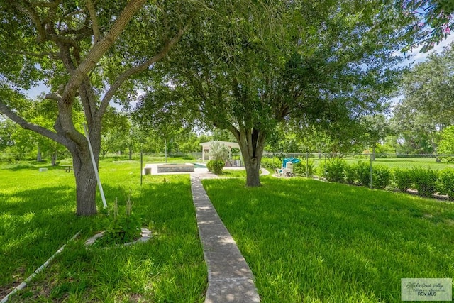 view of home's community with a yard