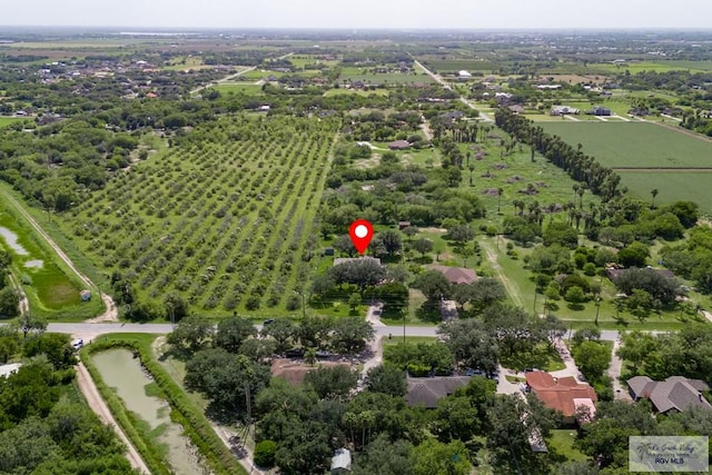 birds eye view of property with a rural view