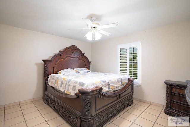 tiled bedroom featuring ceiling fan