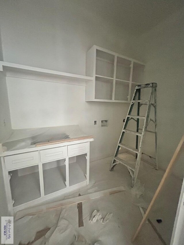 132 Finch Dr, Los Fresnos, TX 78566 - unfurnished living room featuring attic access
