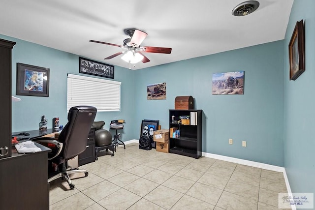 tiled home office featuring ceiling fan