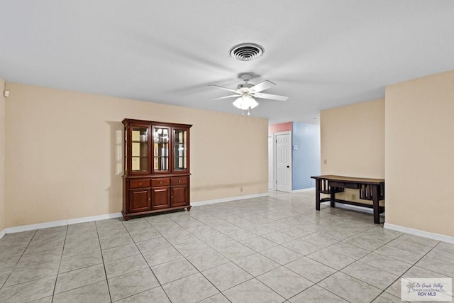 unfurnished room featuring ceiling fan and light tile patterned flooring