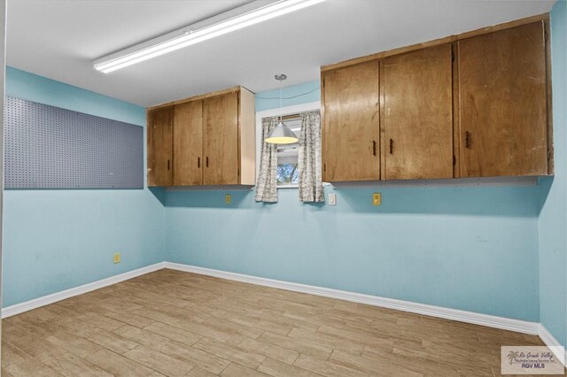 washroom with light hardwood / wood-style flooring