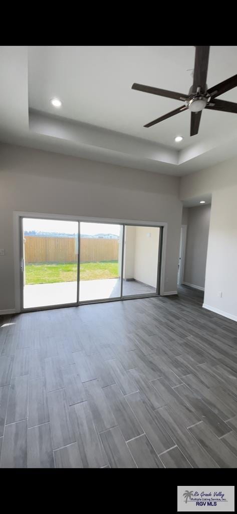 unfurnished living room with recessed lighting, baseboards, ceiling fan, and wood tiled floor