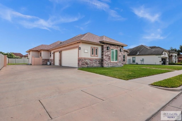 5706 Spicewood, Harlingen, TX 78552 - view of property exterior with stucco siding, stone siding, an attached garage, and concrete driveway