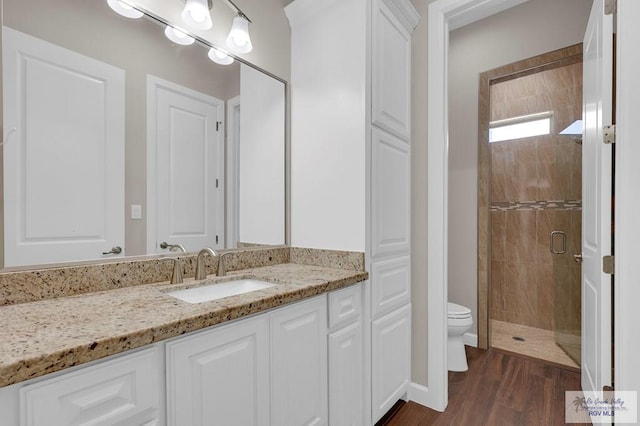 5706 Spicewood, Harlingen, TX 78552 - full bathroom with a shower stall, vanity, and wood finished floors