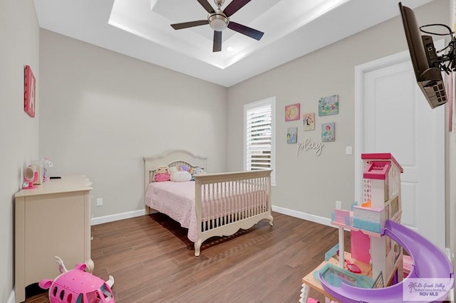 5706 Spicewood, Harlingen, TX 78552 - bedroom featuring wood finished floors, a tray ceiling, recessed lighting, and ceiling fan
