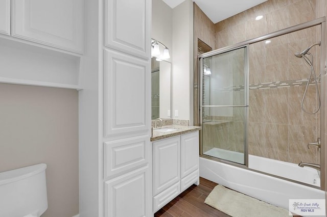 5706 Spicewood, Harlingen, TX 78552 - bathroom with vanity, enclosed tub / shower combo, and wood finished floors