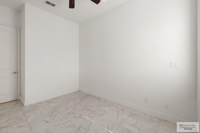 110 E Retama St, South Padre Island, TX 78597 - spare room featuring light marble finish floors and ceiling fan